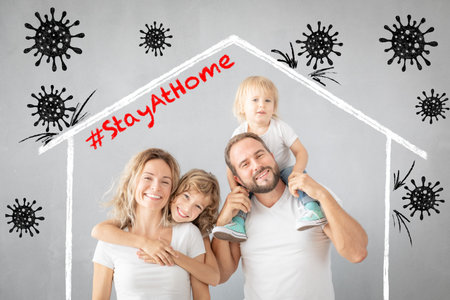 Happy family stay at home. People maintain quarantine to prevent spreading infection.の写真素材