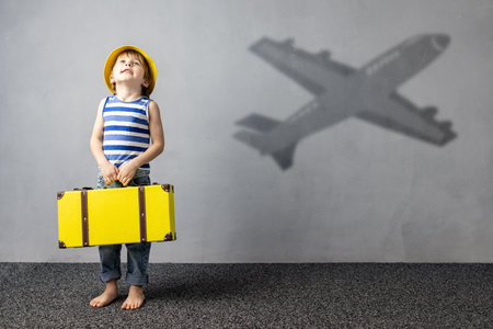 Happy child dreaming about travel. Summer vacation conceptの写真素材