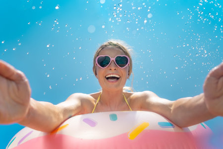 Happy woman having fun on summer vacation outdoor against blue sky background. Spring break!