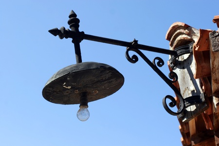 old forged lantern in Old Nessebar on blue skyの写真素材