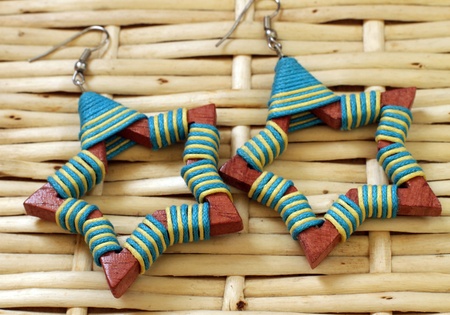 Wooden earrings in ethnic style on the wooden tableの写真素材