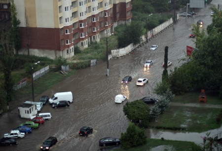 ODESSA, UKRAINE - Jule 16  Cars attempts to go along the steet through flood waters after a heavy rain on Jule 16, 2012 in Odessaのeditorial素材