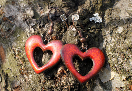 The beautiful hand made polymer clay heart ear ringsの写真素材