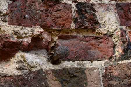 The old nail into the brick wall of ancient buildingsの写真素材