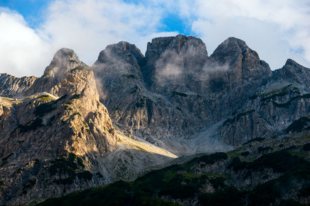 cliffs in the clouds high in the mountains in the morningの写真素材