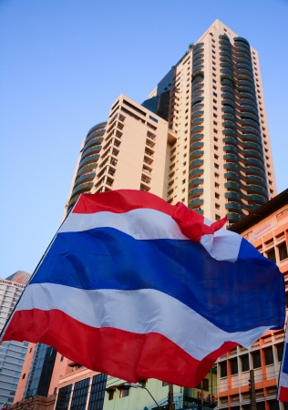 nation flag of Thailand on building backgroundの写真素材