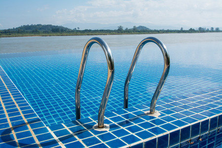 Swimming pool near Khong river with blue sky ,Chiangsan in Chiangrai ,Thailandのeditorial素材