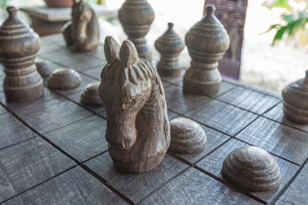 Ancient Thai wooden chess were lined on the board