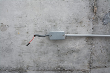 electric system on ceiling in construction site ,outlet with iron pipes