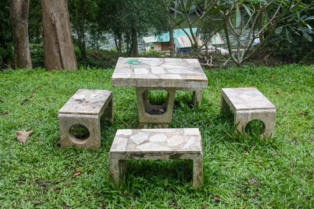 outdoor marble table and four chairs.の写真素材
