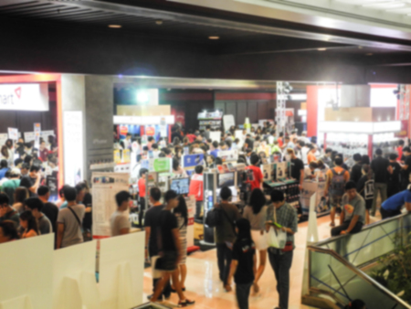 Abstract people walking in exhibition blurred backgroundの写真素材