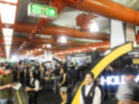Abstract people walking in exhibition blurred backgroundの写真素材