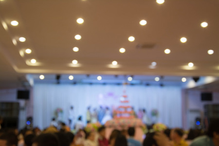 blur image of wedding party in large hall for background usage.の写真素材