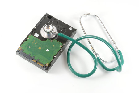 hard disk with a sthetoscope isolated on white background