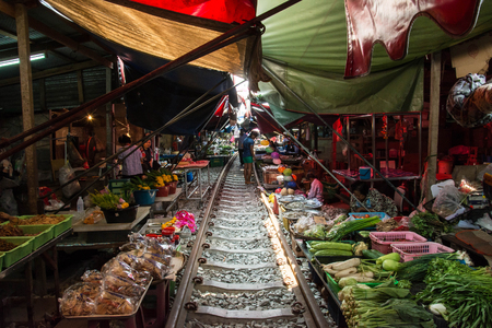 MAEKLONG, THAILAND-MAR.19: The famous railway markets at Maeklong, Thailand, March 19 th, 2016, Bangkok, Thailand.Three times a day the train runs through these stalls.のeditorial素材