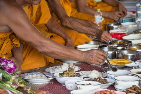 food and drink for monks in traditional religious ceremony in a temple , Thailand.の写真素材