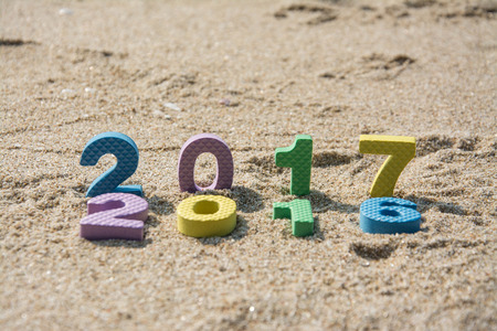 New Year 2017 concept ,text on the beach sandの写真素材