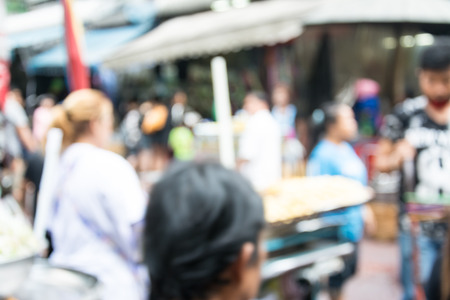 Blurred image of people walking at marketの写真素材