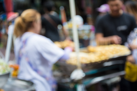 Blurred image of people walking at marketの写真素材