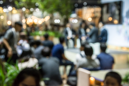 Abstract people walking in exhibition blurred backgroundの写真素材