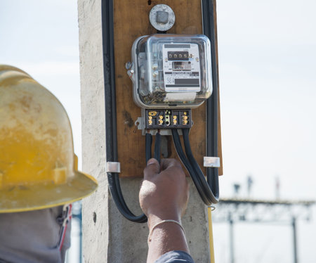 electrician builder  installing  electricity  meterの写真素材