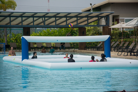 PATTAYA, THAILAND - NOVEMBER 12, 2017: People play volleyball in the water pool at RamaYana Water Park, New recreation in Pattaya , Thailand. のeditorial素材