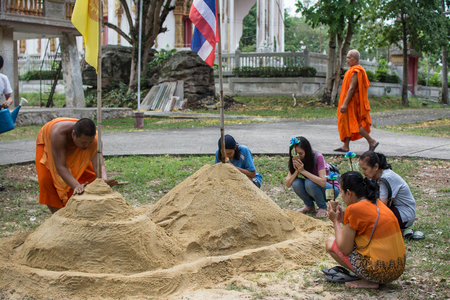 Prachin Buri, Thailand - April 14, 2018:  Thai people come to build the Sand Pagoda for return the sand to the temple on Songran festival at Pho temple のeditorial素材
