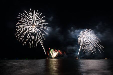 Beautiful firework display for celebration over the seaの写真素材
