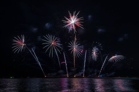 Beautiful firework display for celebration over the seaの写真素材