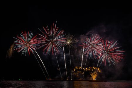 Beautiful firework display for celebration over the seaの写真素材