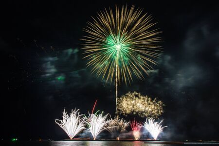 Beautiful firework display for celebration over the seaの写真素材