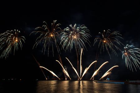 Beautiful firework display for celebration over the seaの写真素材