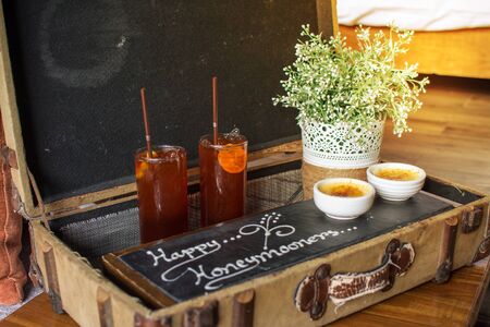 Breakfast tray in bed in hotel room. honeymoon box setの写真素材