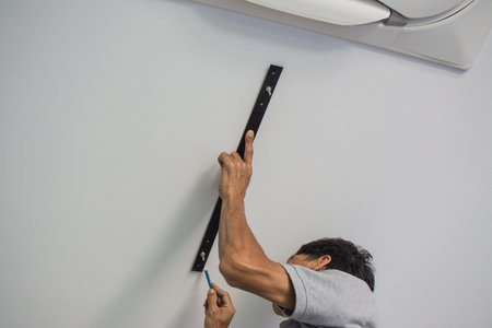 man install hanging lamp on the ceiling 