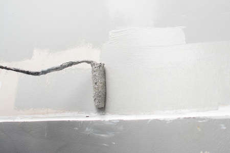 using paint roller for paint building wallの写真素材