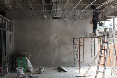 Interior construction site with workerの写真素材
