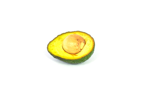 avocado cut half isolated on white backgroundの写真素材