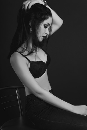 Dramatic black and white studio portrait of a beautiful and sexy girlの写真素材