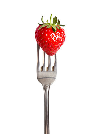 Strawberry on a fork isolated on white background. Clipping Pathの素材