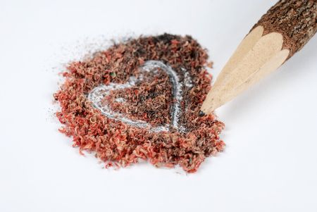 Sharpened natural pencil and Heart shaped dustの写真素材