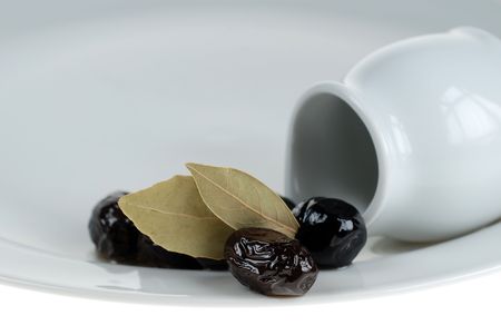 Black olives on white service plate, beauty of blackの写真素材