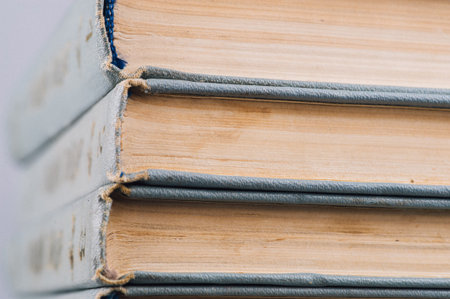 stack of old and used books with dirty pages