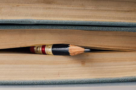 Hundred Page Book Background with small perfect pencil in-between pagesの写真素材