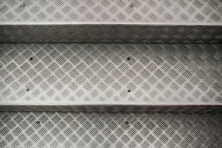 Aluminum steps on a stairway with non-slip pattern.の写真素材