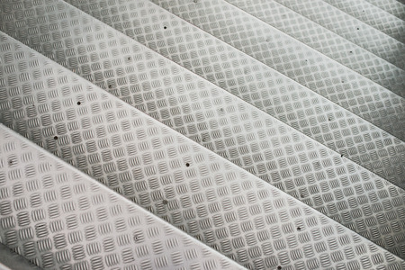 Aluminum steps on a stairway with non-slip pattern.の写真素材