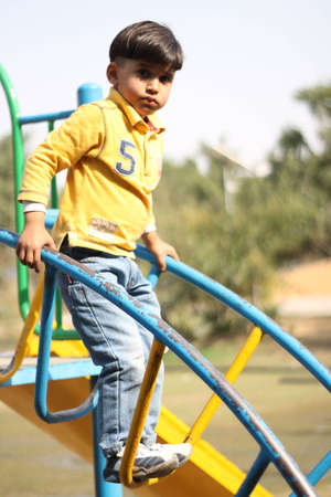 boy swing in parkの写真素材