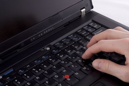 typing on a laptopの写真素材