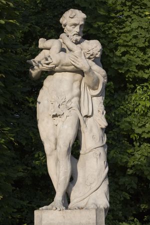 monument of an old man with a child on his handsの写真素材