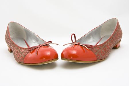 pair of red woman shoes on white backgroundの写真素材