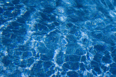 view at a swimmingpool with blue mosaic tiles